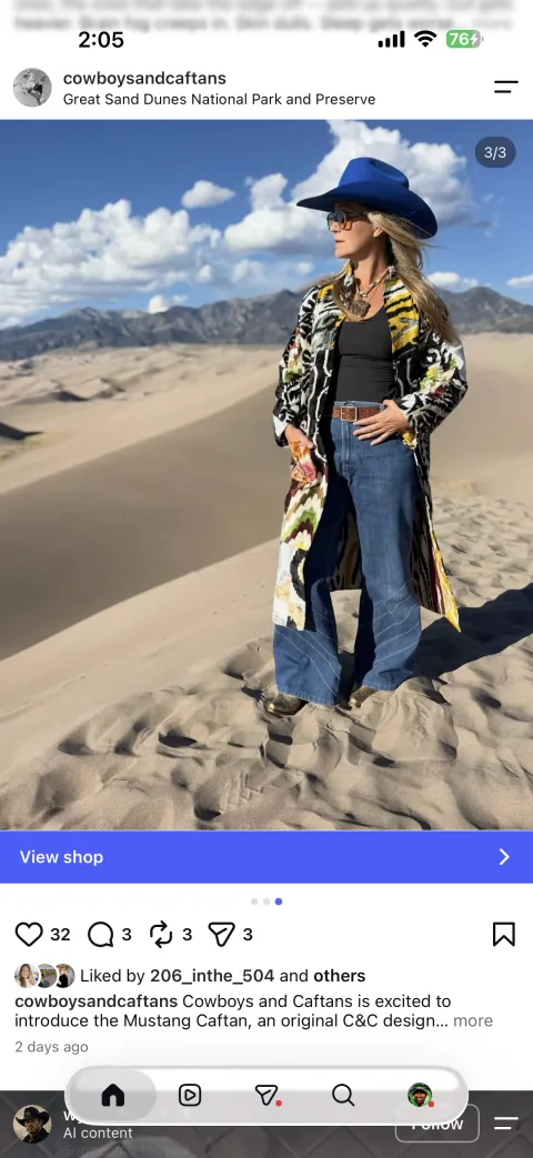 The third published Instagram frame: a front-facing portrait in the Mustang caftan against the dunes and mountains.